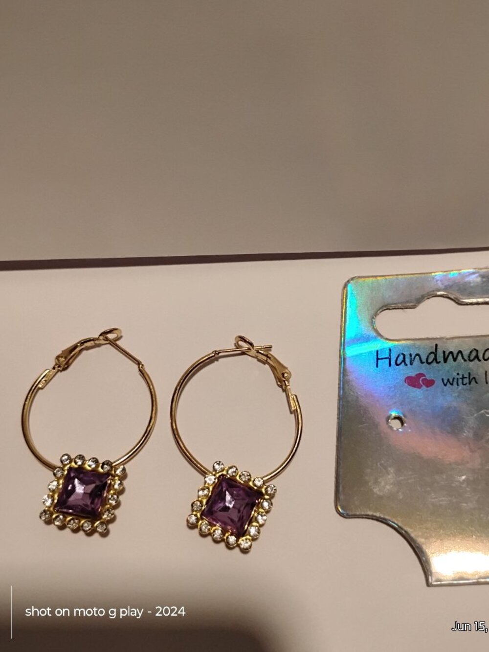 Gold hoops purple stone diamond